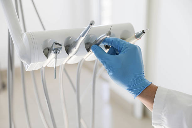 Professional Tooth Extraction technician working in Cedar Rapids, IA